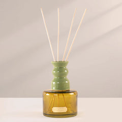 Cosmic - Natural Diffuser - Olive - Sage Cleanse, olive glass bottle with ceramic reed collar and reeds, front view