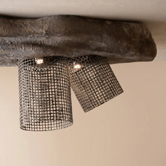Industrial-style ceiling light fixture with two cylindrical black wire mesh shades