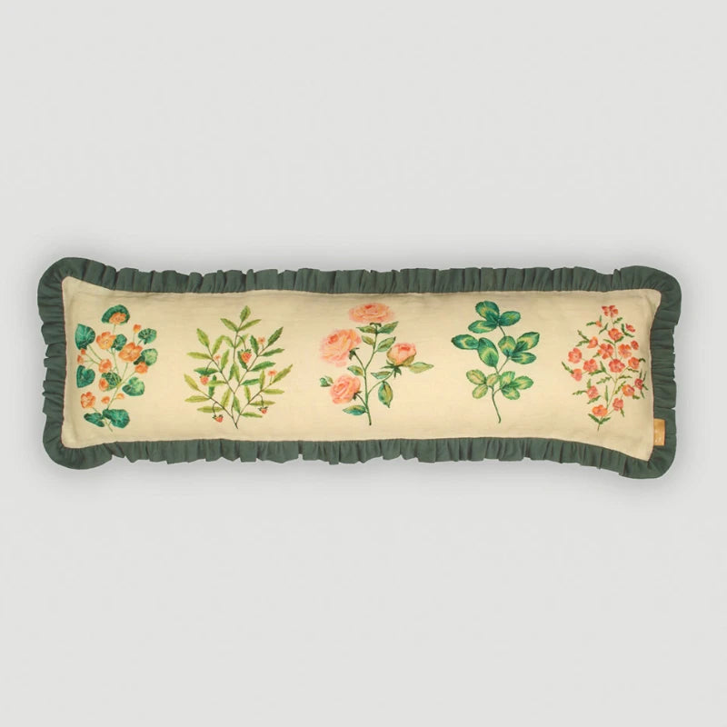 Fiora Ivory Linen Lumbar Cushion Cover front view, five botanical motifs with green ruffle
