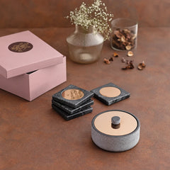 A set of Yin Nut bowl in black marble and brass for snacks or desserts, plus matching coasters made of brass and marble
