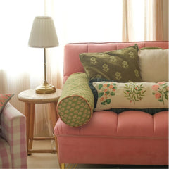 Fiora Ivory Linen Lumbar Cushion Cover on pink sofa beside side table and lamp