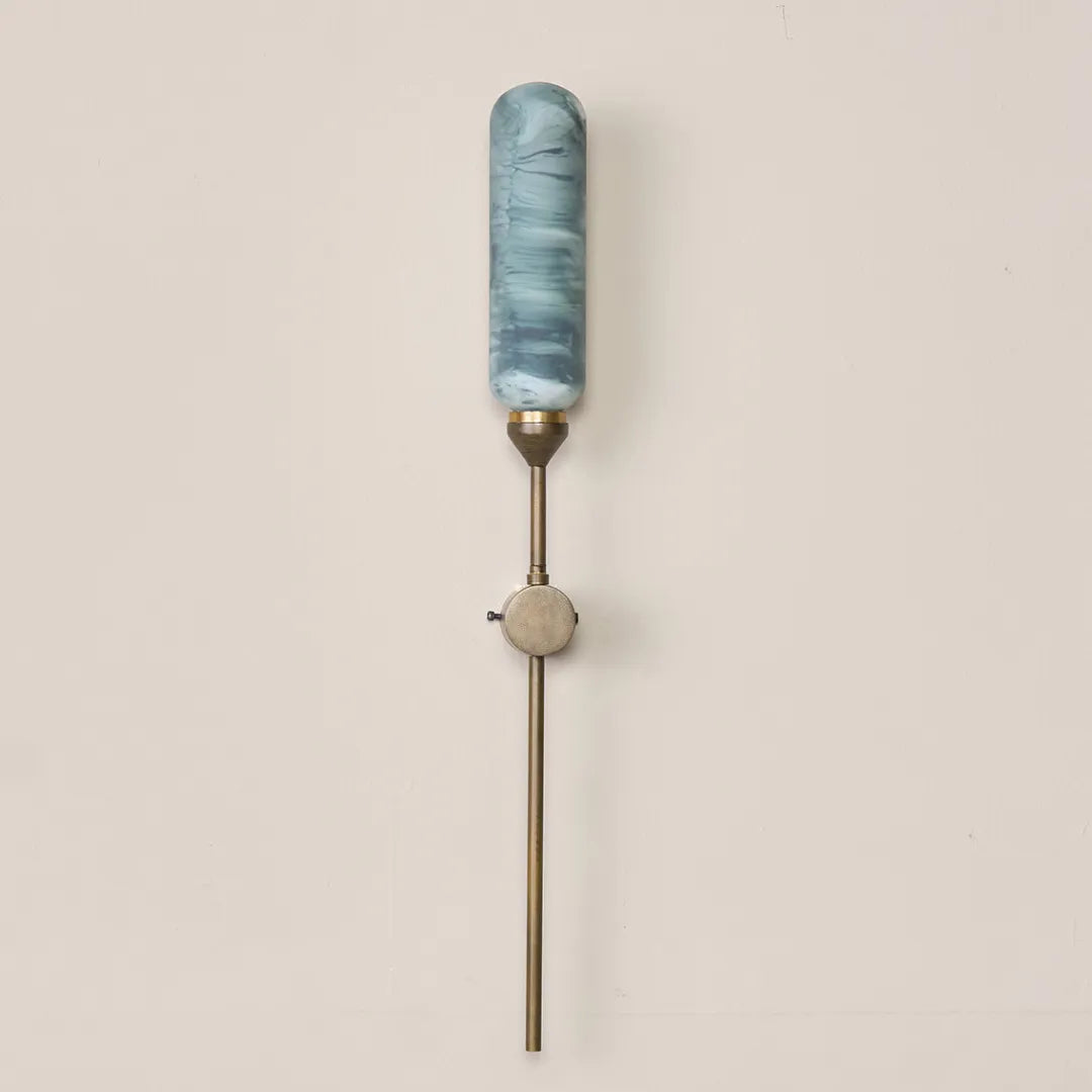 Decorative outdoor wall-mounted lamp in green marble-painted glass with a rich golden outdoor finish.