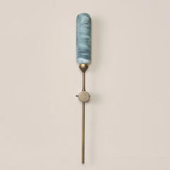 Decorative outdoor wall-mounted lamp in green marble-painted glass with a rich golden outdoor finish.