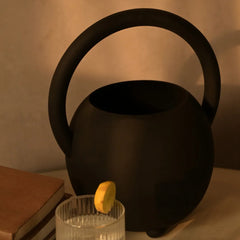 Black Halo Vase, decorative home decor item placed on a wooden surface.
