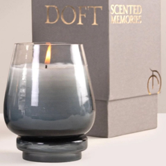 Cosmic Hues - Lid Jar Candle | Blue | Balmy Bergamot, lit close-up beside grey Doft Scented Memories box