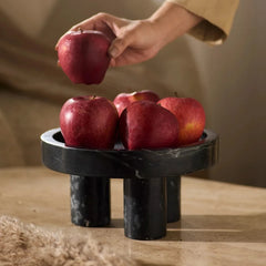 Column Series Bowl - Black Marble, Hand Placing Apple on Footed Bowl