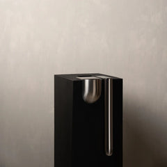 A premium black rectangular Bookcase Vase featuring a polished silver metallic bowl-shaped accent and a vertical silver handle
