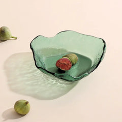 Moss Green glass bowl with figs on a beige background