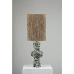 Natura Table Lamp with a textured brown shade and a green marble base on a white pedestal