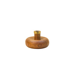 Warm Wave Candle Holder made of teak wood with brass top on a white background
