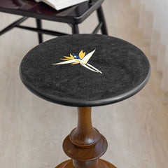 Bird of Paradise - Walnut, angled view of stone inlaid black marble top in room setting