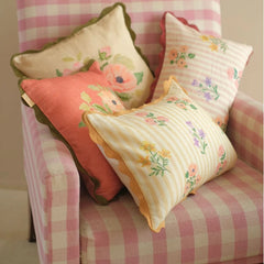 Rosalia Amber Linen Oblong Cushion Cover with floral cushions on gingham armchair