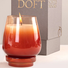 Cosmic Hues - Lid Jar Candle | Orange | Summer Nectar, lit close-up beside grey Doft Scented Memories box