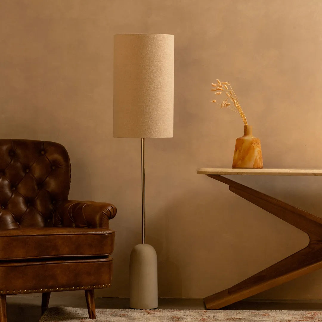 Ombrello floor lamp combines a sandstone base with a stainless steel pipe