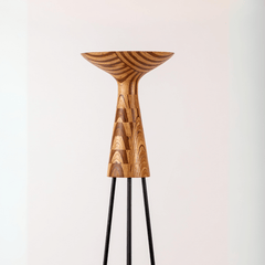 Designer Hourglass Floor Lamp close-up detail of its upcycled-plywood hourglass and black metal stand
