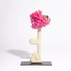 Decorative Sirsasana Vase with pink flowers on a white background