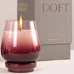 Cosmic Hues - Lid Jar Candle | Purple | Opulent Oud, lit plum ombre glass close-up beside grey Doft box