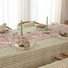 Valley Rose Linen Table Runner with place settings and green candles, side view