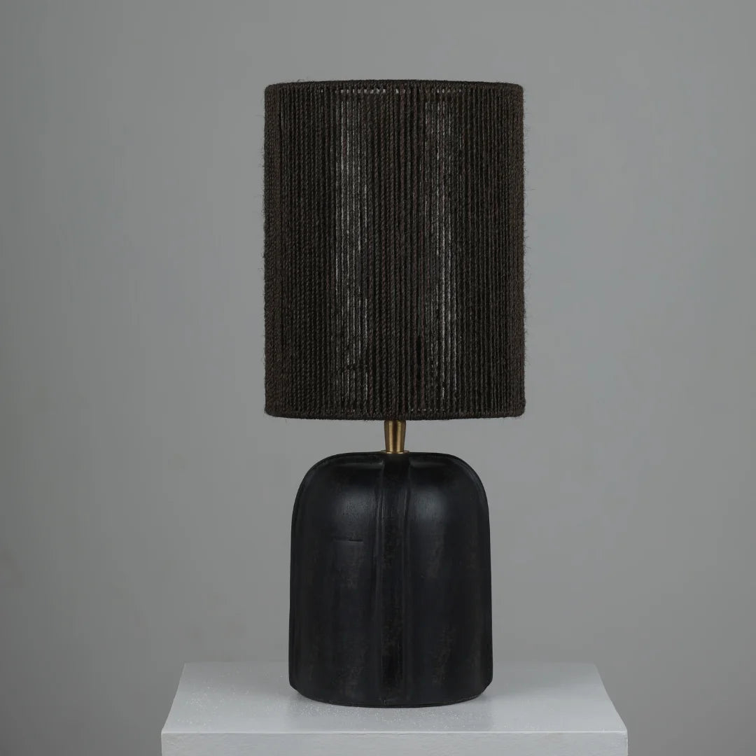 Black Elara Table Lamp with textured shade and black base on a gray background