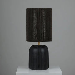 Black Elara Table Lamp with textured shade and black base on a gray background