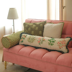 Sofia Forest Green Embroidered Cotton Cushion Cover on pink sofa with lumbar and bolster cushions