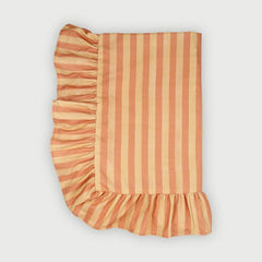 Linea Ruffle Amber Cotton Table Cover laid flat, striped print with gathered ruffle border
