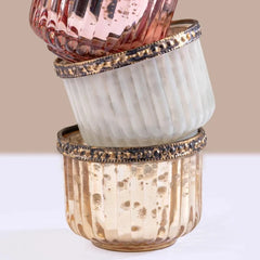 Gilded Votive Candle Gift Set with Golden Vanilla fragrance, close-up of blush, ivory and gold votives stacked
