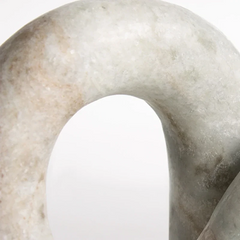 Close view of Loon Chain sculpture of Curved Arch and Natural Marble Texture