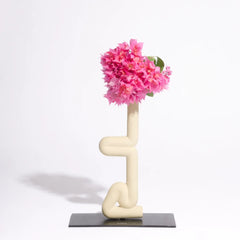 Modern white vase with Sirsasana yoga pose