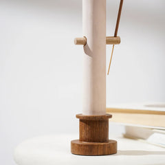 Wooden base with incense holder on a white background