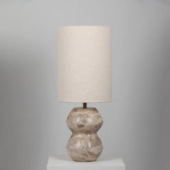 Decorative Cascata Table Lamp with a textured beige fabric shade and marble base.
