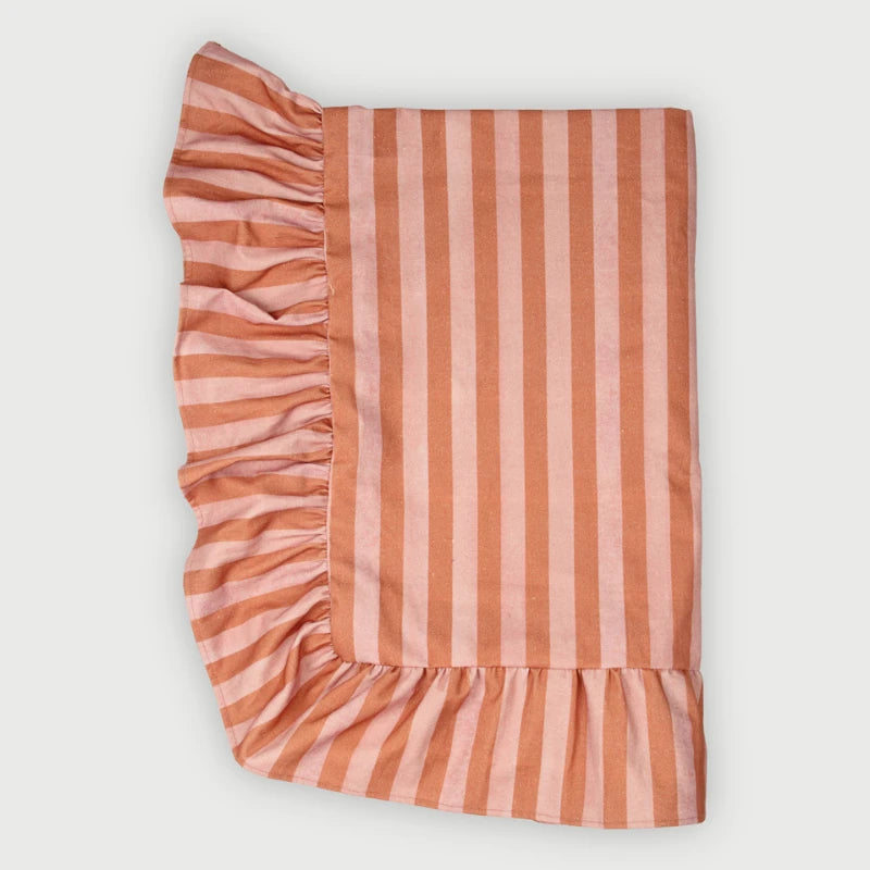 Linea Ruffle Dusty Rose Cotton Table Cover laid flat, striped print with gathered ruffle border
