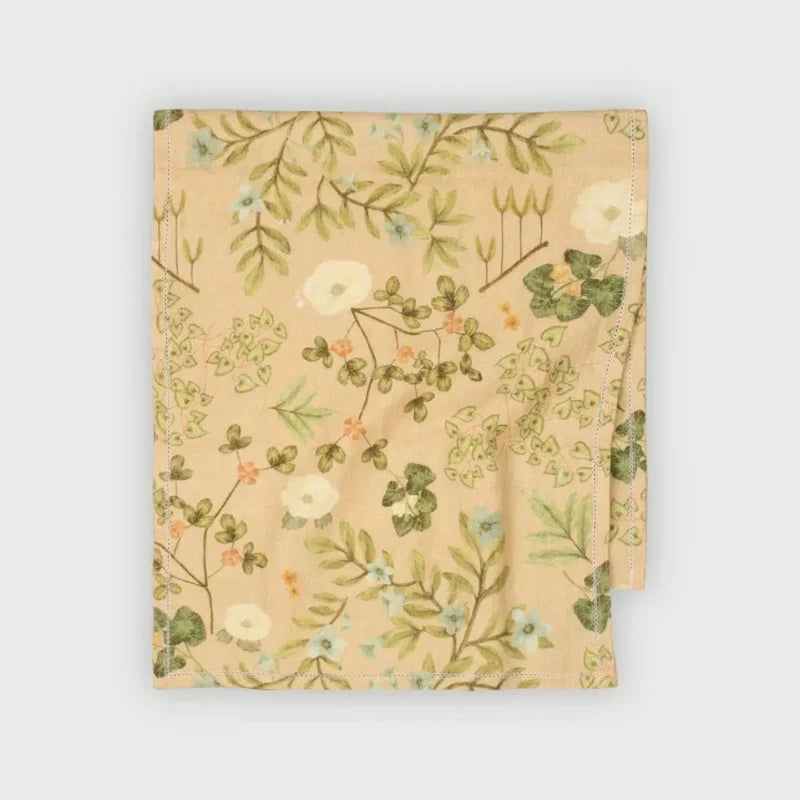 Valley Peach Linen Table Runner folded, showing Himalayan floral print