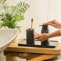 Baroda Green Soap Dispenser Set - In Use, Hands at Pump Beside Basin and Plant