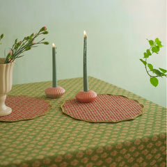 Viola Ruffle Forest Green Cotton Table Cover with quilted round placemats and taper candles, close view