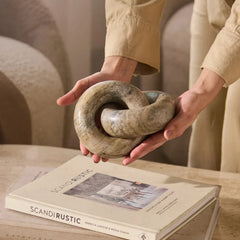Decorative Moro Chain - Held in Hands Above Books, Rounded Link Form 