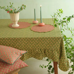 Viola Ruffle Forest Green Cotton Table Cover on dining table with round placemats, candles and cushions