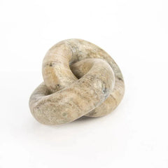 lose-Up of Moro Chain, a polished stone knot sculpture with a smooth, rounded texture in natural beige, gray, and brown tones, set against a plain white background.