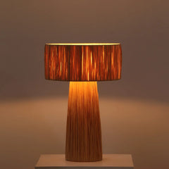 Fiume table lamp with a textured brown shade on a neutral background