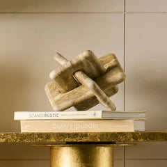 Orven Chain - Styled on Books atop Gold Table Against Beige Wall