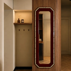 Orvane Wall Mirror full-length octagonal maroon frame mounted on a wood-panelled entryway wall