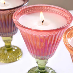 Sundae Votive Candle - Petal · Berry Blonde, close-up of lit wax and beaded glass rim