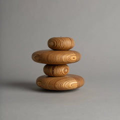 Stack of three marine plywood Pebbled Tealights on a gray background