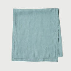 Powder Blue Linen Table Runner folded, solid flat-weave linen with hem-stitch