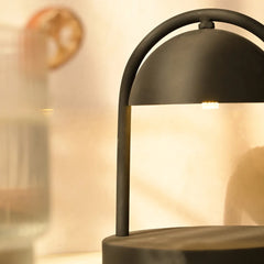 Modern black Mirth table lamp with a blurred background