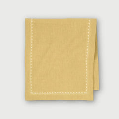 Mirage Sand Linen Table Runner folded, showing embroidered triangle border