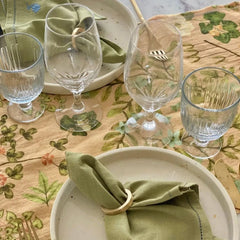Valley Peach Linen Table Runner with crystal glassware and place settings, close view
