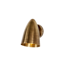 A small cone-shaped wall sconce made of brass with a visible hinge at the top