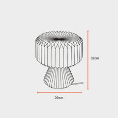 A white origami paper table lamp, product by Fig Living, dimensions mentioned 