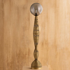 Dawn Floor Lamp full view in hand-hammered grey recycled glass and brass wire shade on a tall twisted metal base